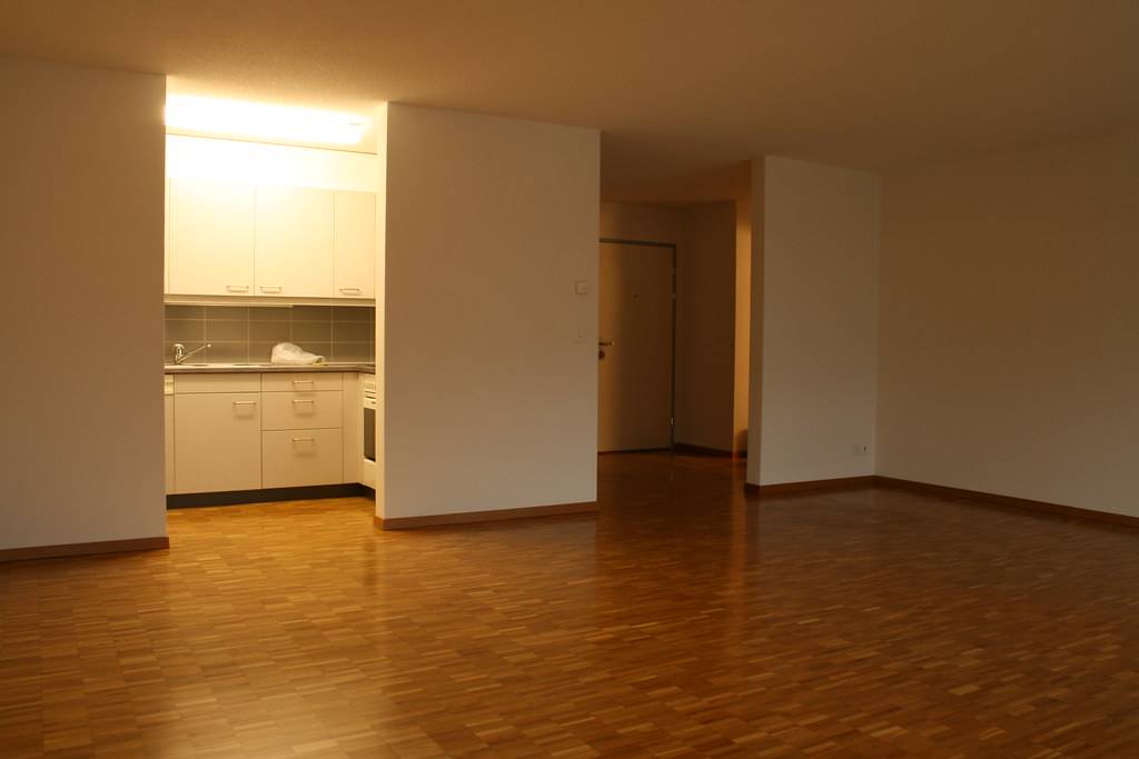 The double living room, looking toward the kitchen.